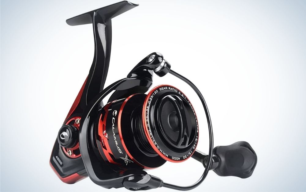 A very complex spinning reel in the form of a machine with different shapes but all in red and black.