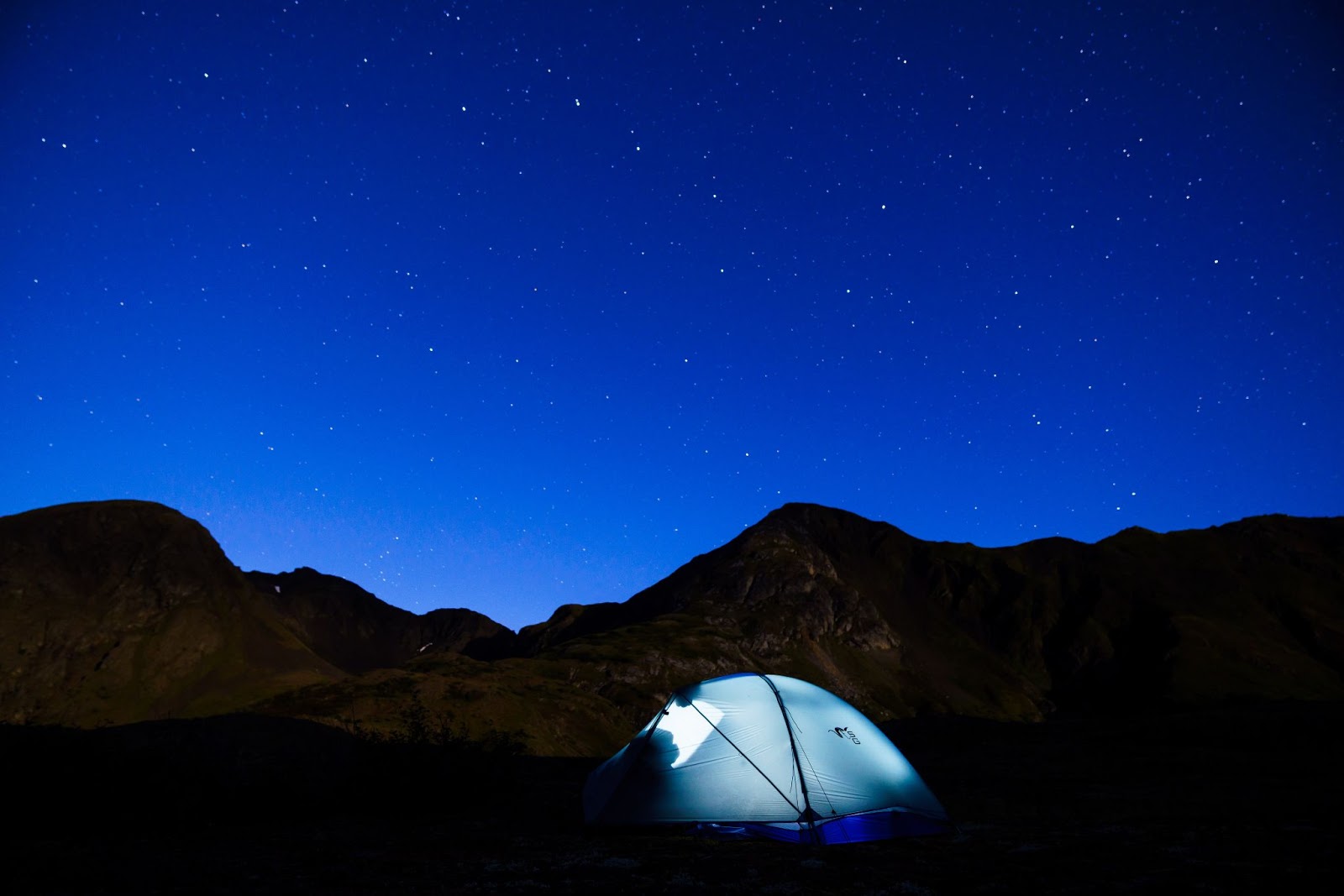 camping in wilderness under a sky full of stars