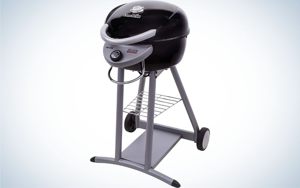 A black and portable electric grill with two gray wheels and a round grill head with the brand name on it.