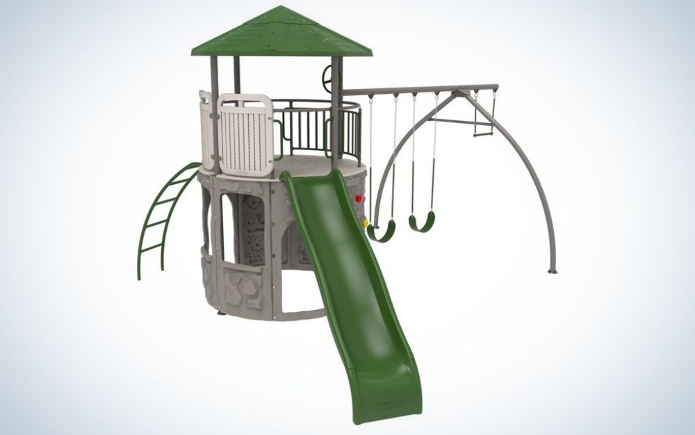A small brown and green playground with several climbing ladders and sliding from the front.