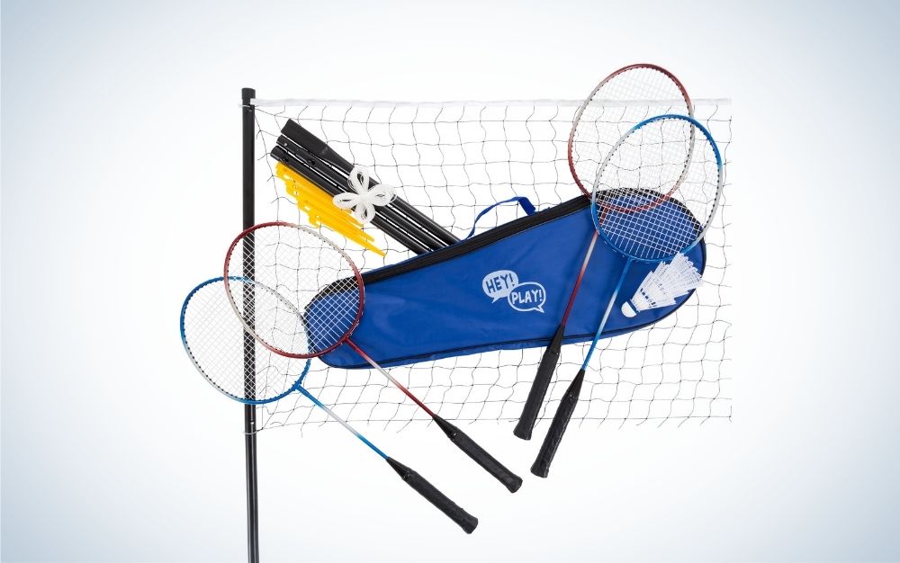A tennis net one bag and four tennis sticks.
