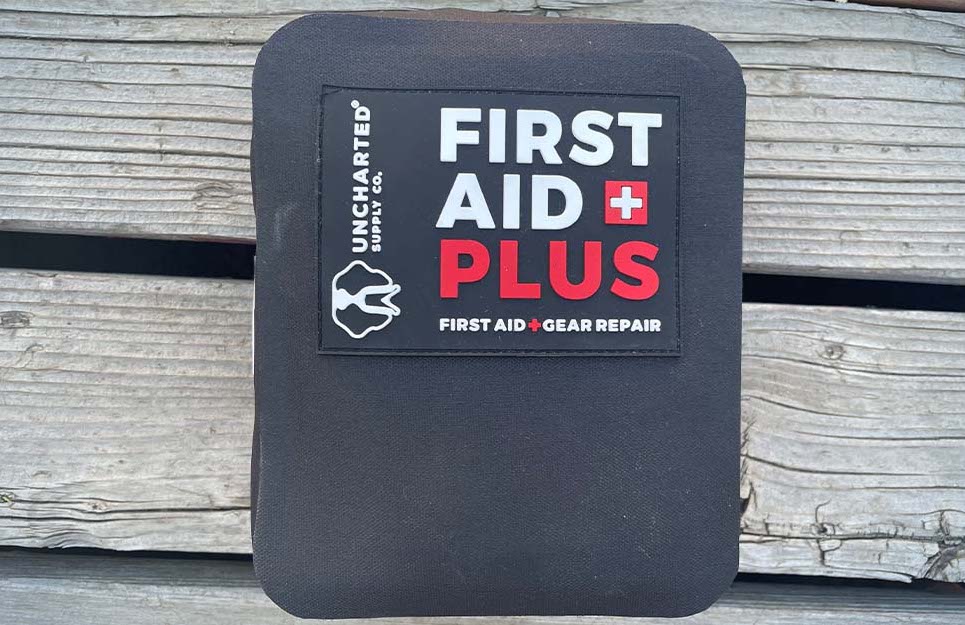 A fully-stocked first aid kit full of necessary gear repair tools.
