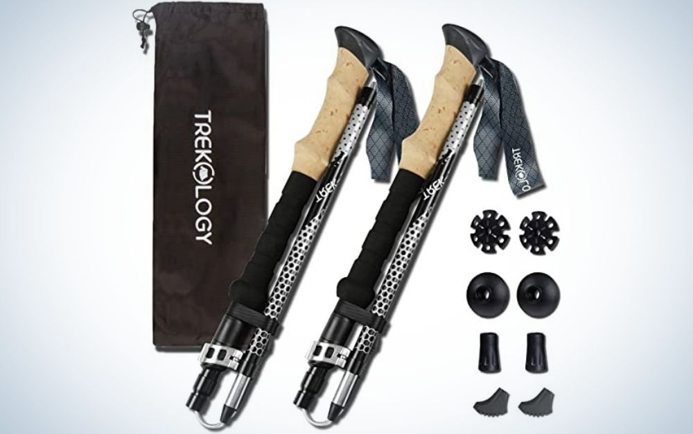 A whole set with two sticks that help to walk on the climb as well as a black bag and some small apparatus in the form of screws that help in the complete formation of the set of trekking pole.
