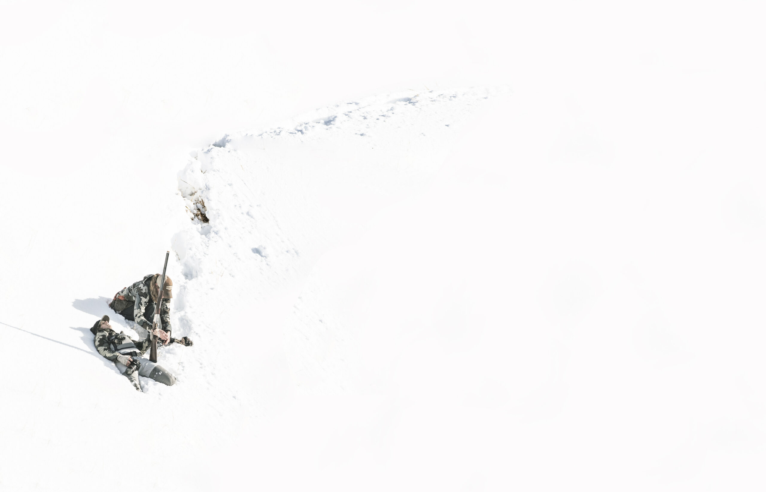 Hunting ptarmigan in the unseasonable snow on Adak.