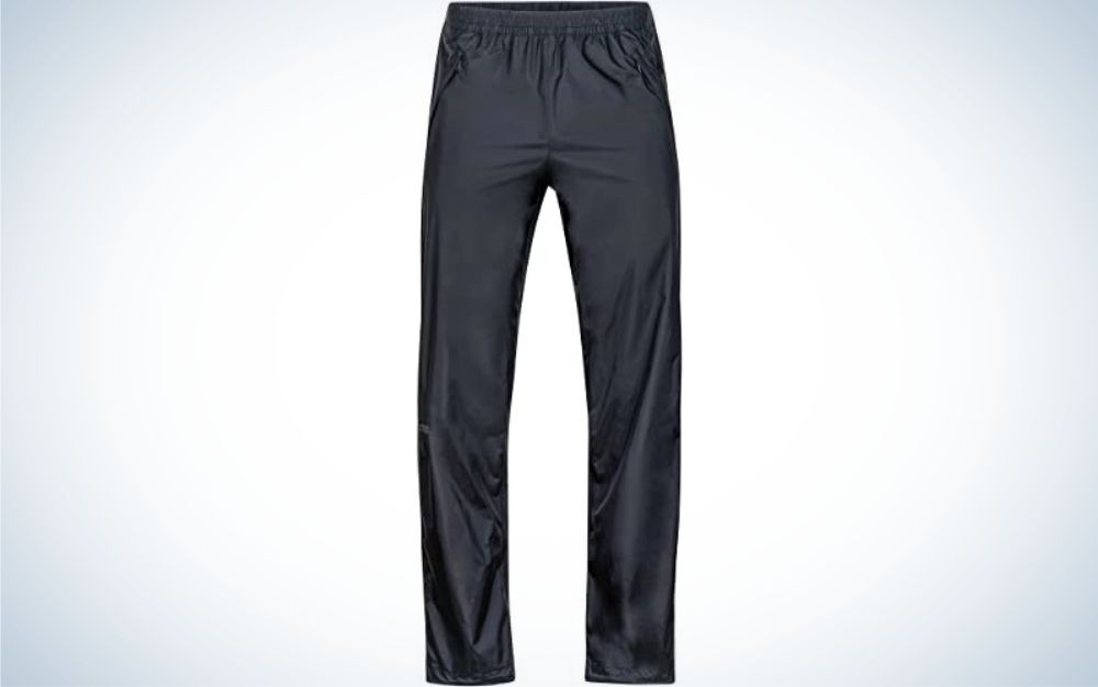 A pair of light gray long pants and material that has shine.