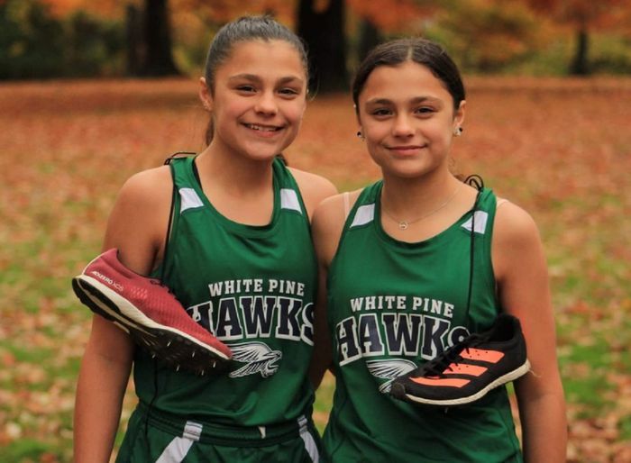 Madison  Sylvester, right, was run over by a whitetail doe while competing in cross-country.