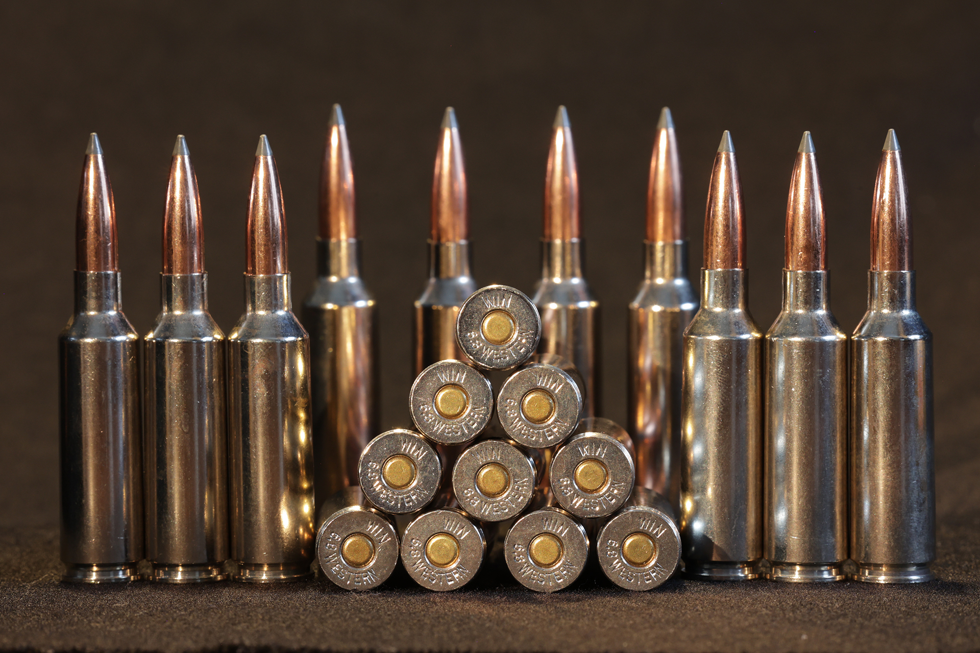 Stack of 6.8 Western hunting cartridges.