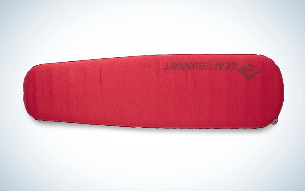 A red, inflatable sleeping pad
