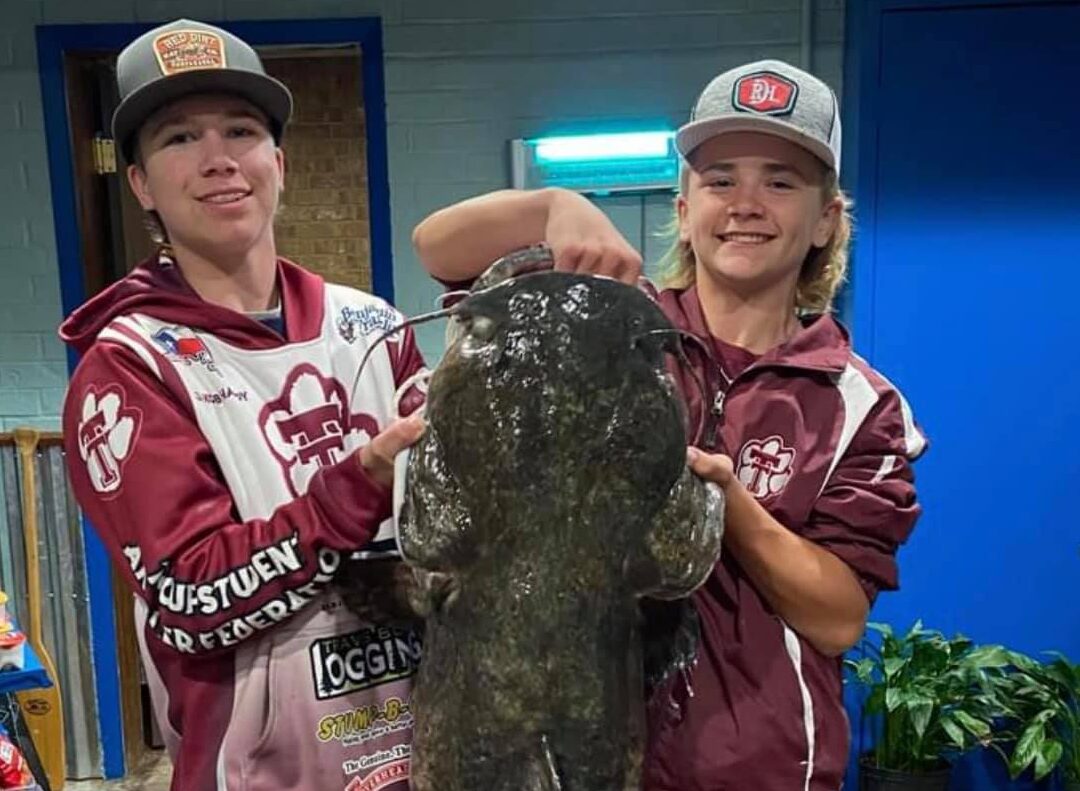 Texas teens catch big Texas catfish.