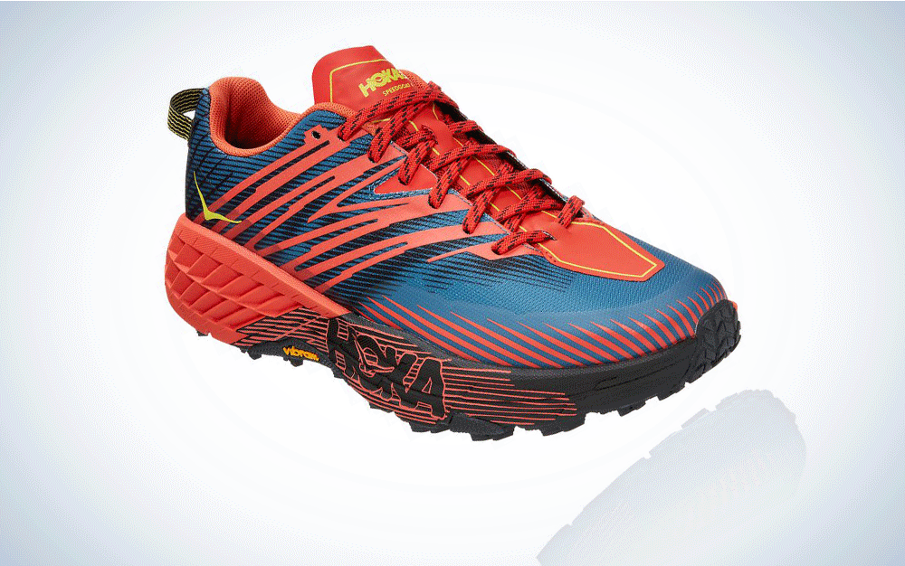 A red and blue trail running shoe