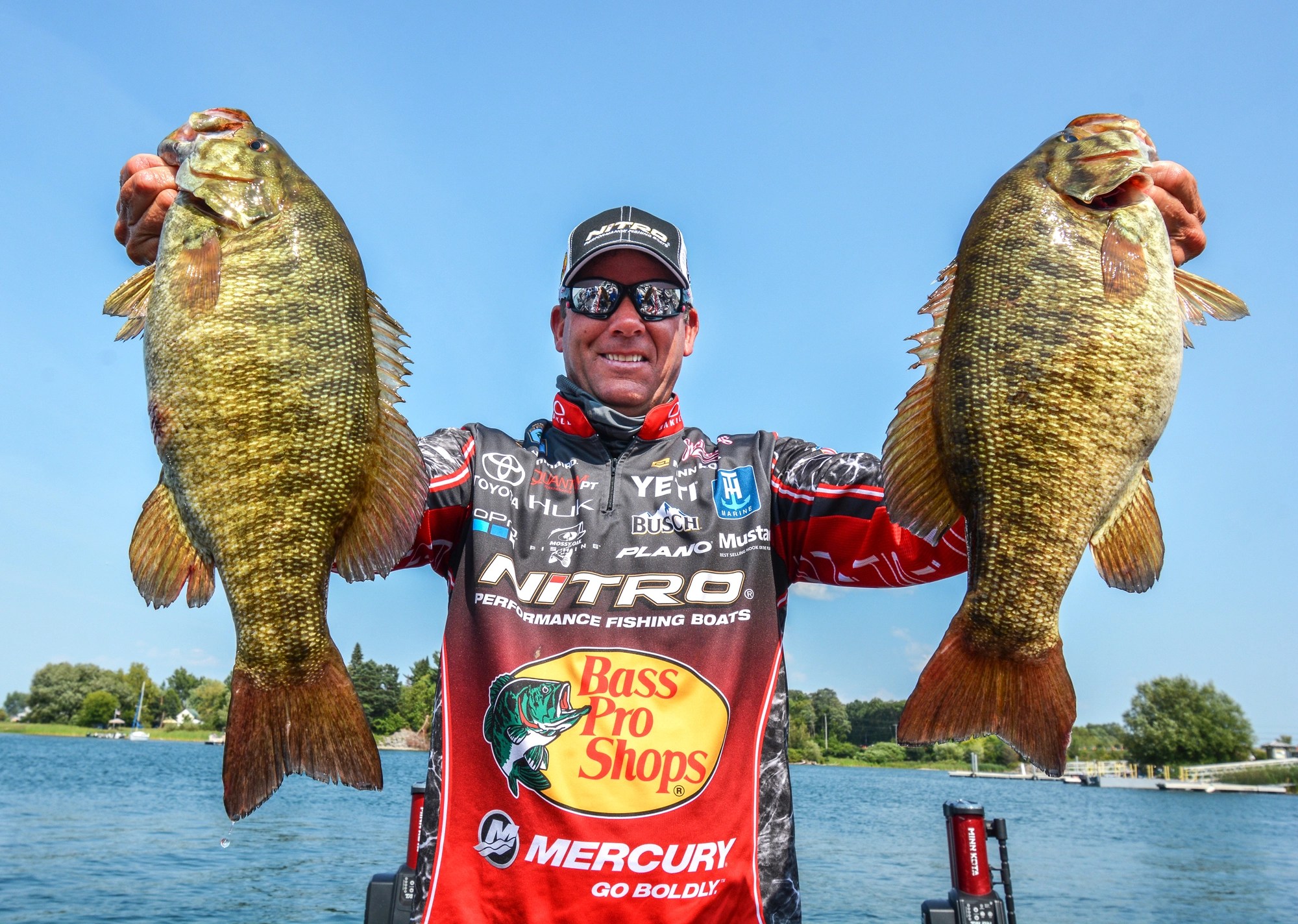 Kevin VanDam holds two smallmouth