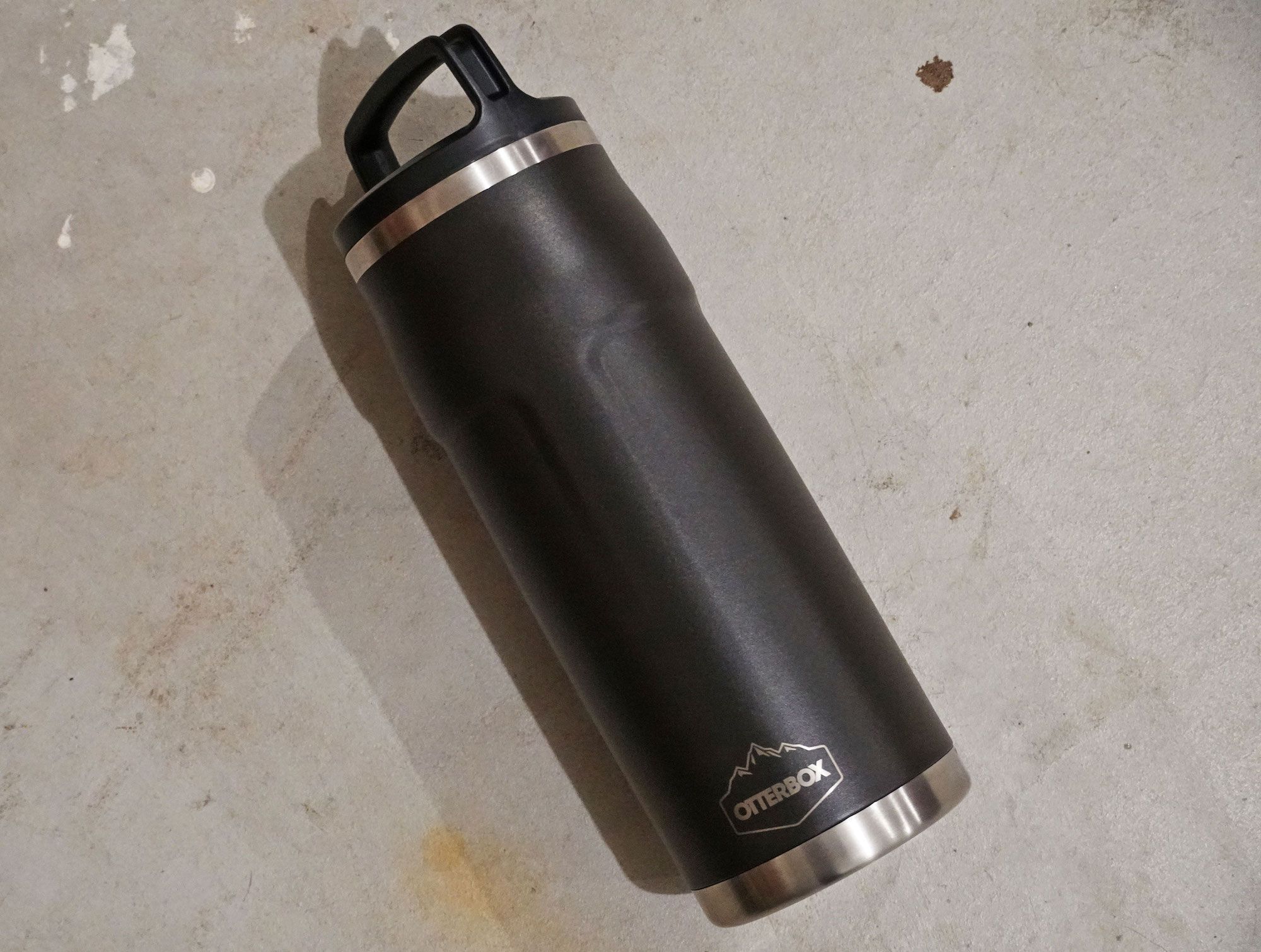 A black Otter Box Elevation Growler thermos