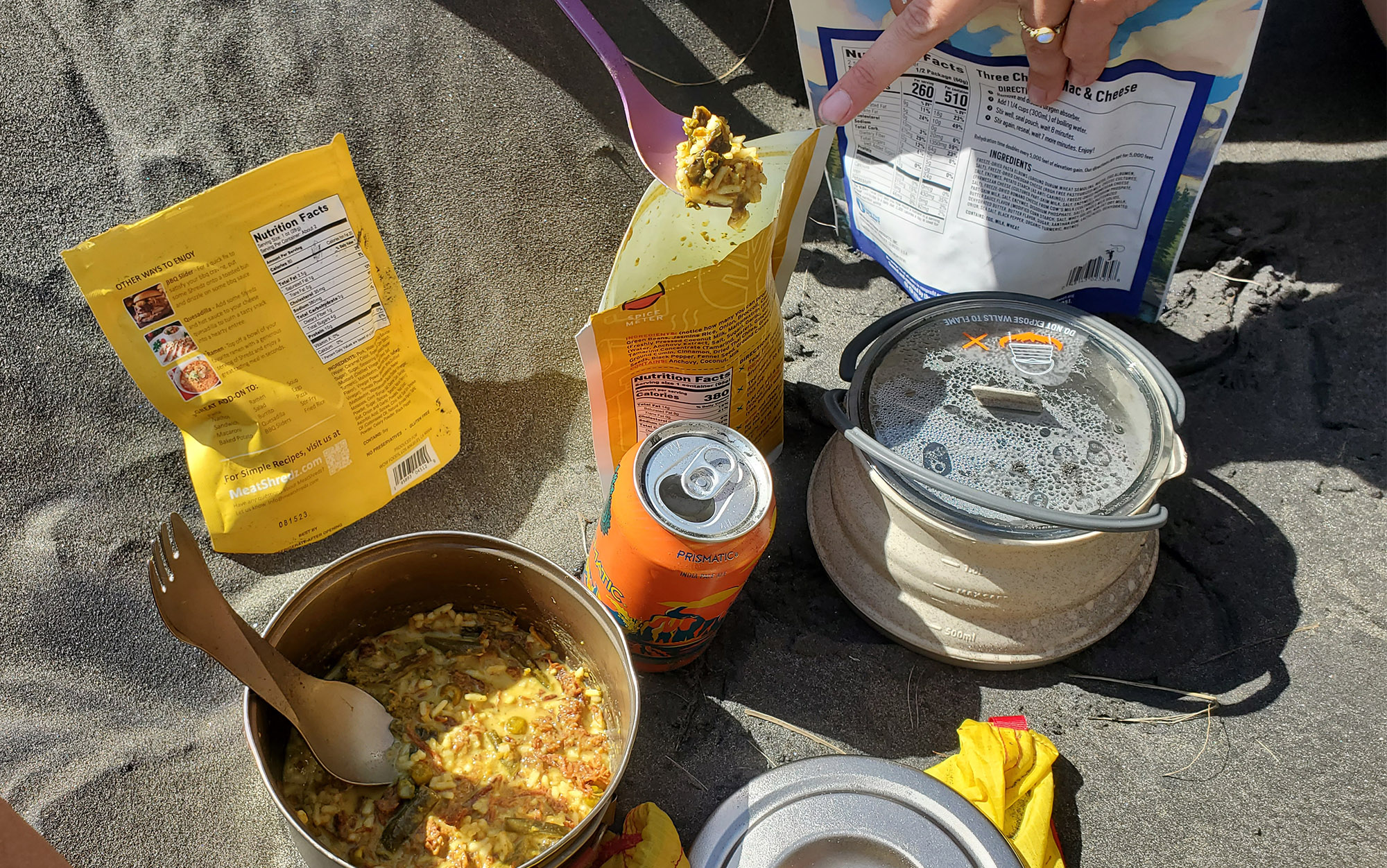 The author and Jac eat a smorgasbord of backpacking food for lunch.