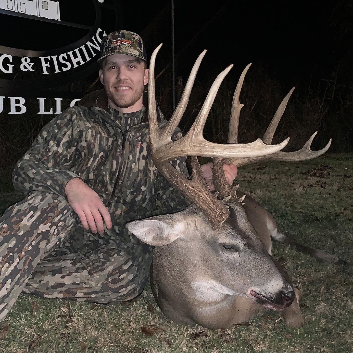 Lane Cox with a stud 13-point buck. 