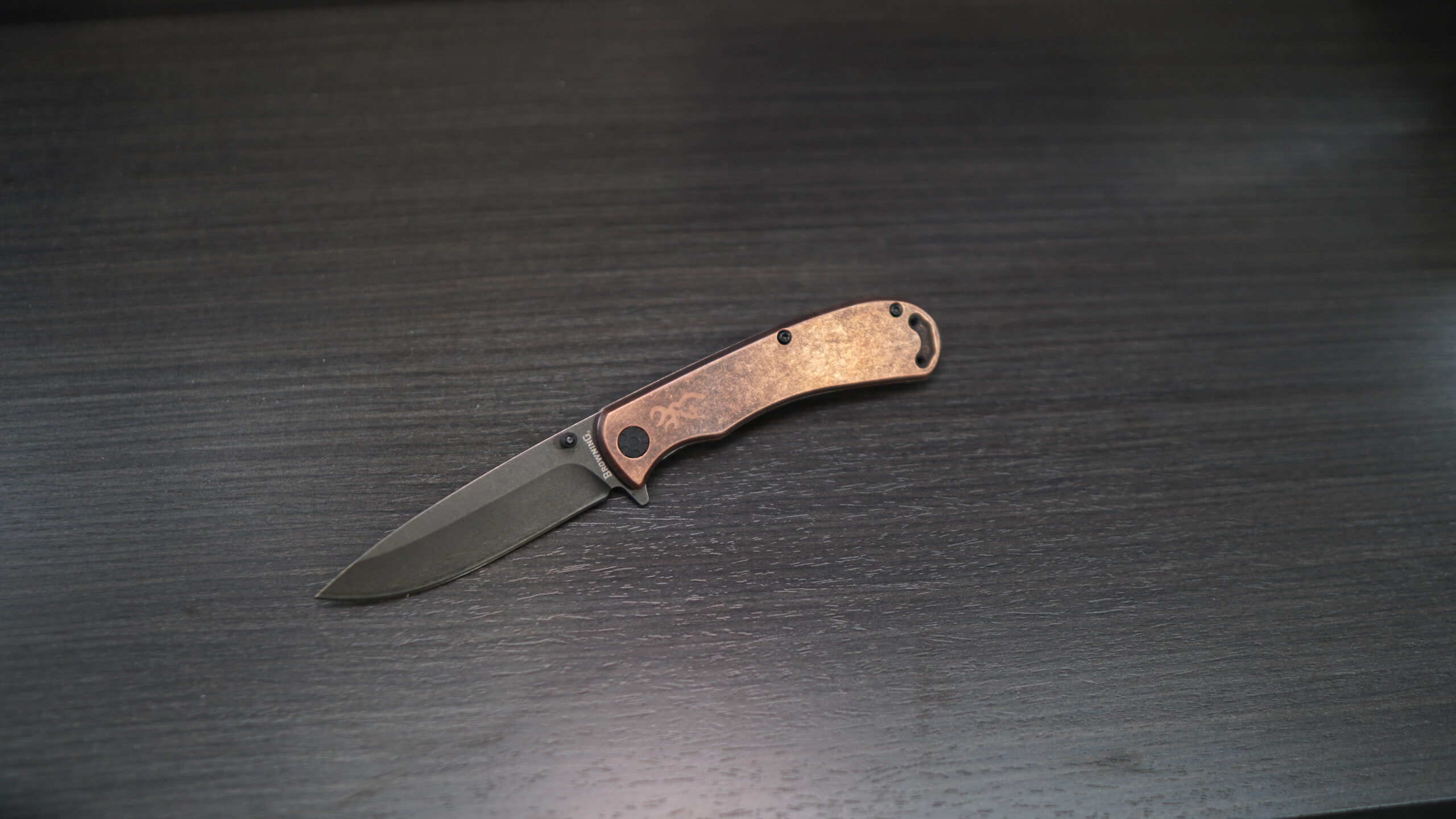 short black knife with copper handles