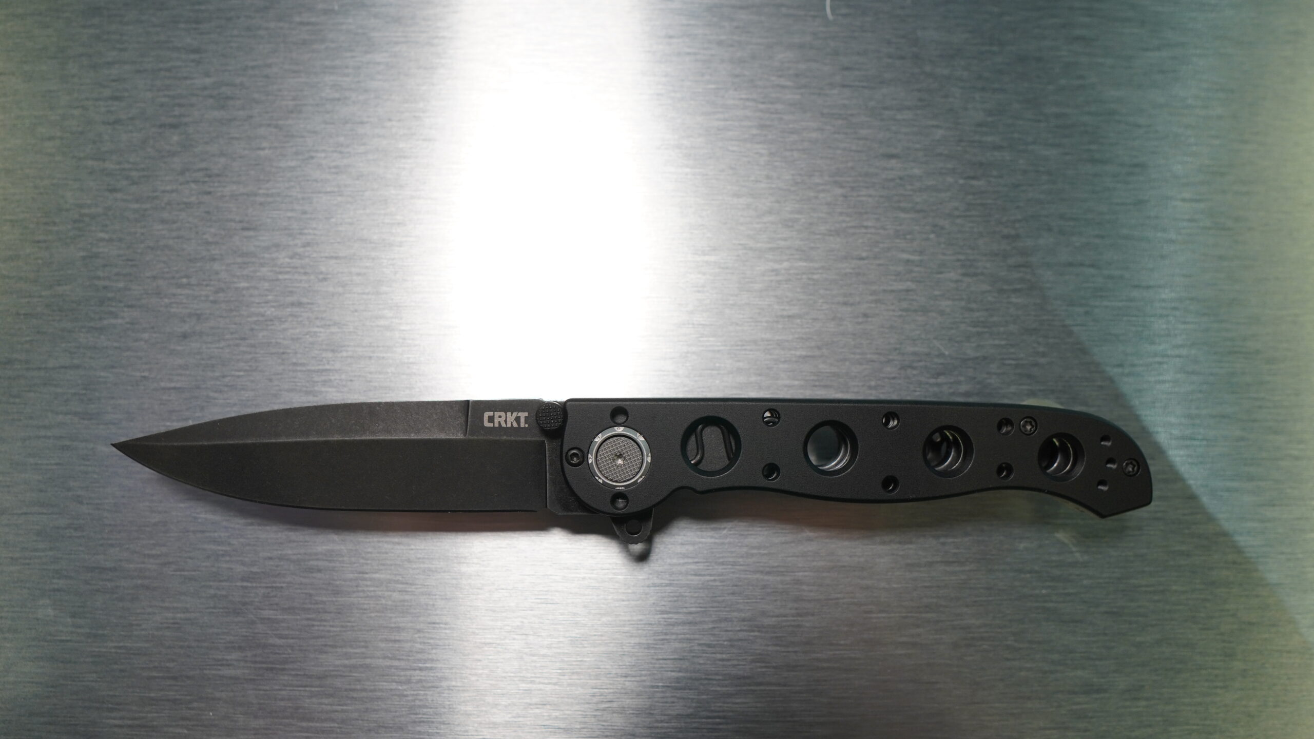 black folding knife with finger assist