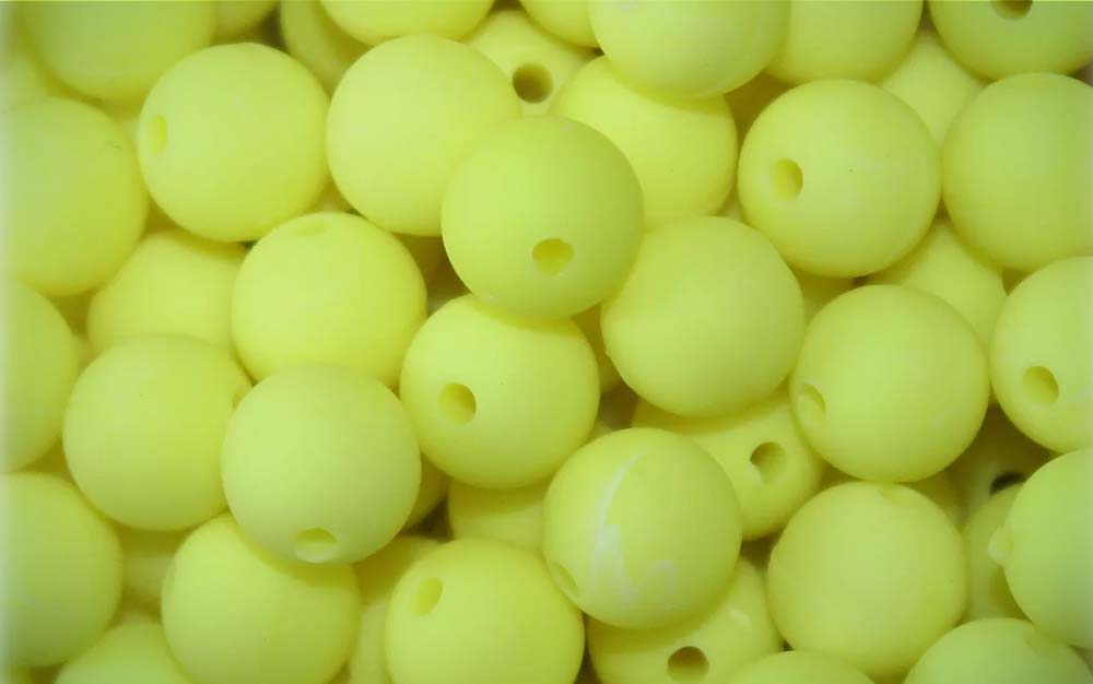 A pile of yellow beads, one of the best trout lures