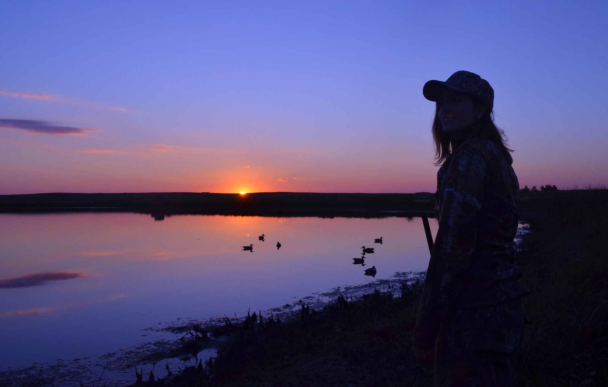duck hunter and midwestern sunset