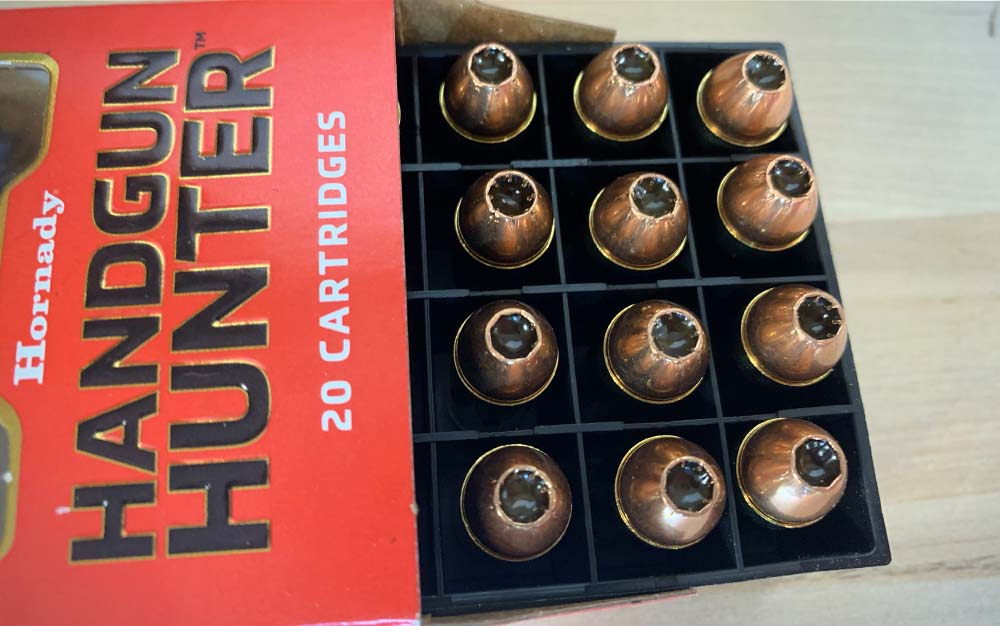 A red box of gold Hornady Hangun Hunter bullets