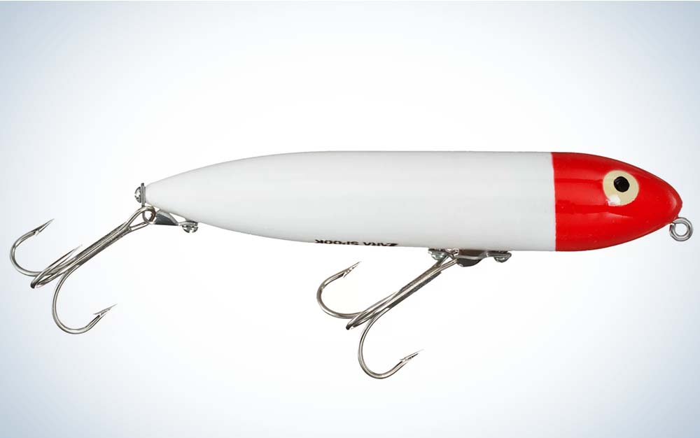 A white best saltwater lure with a red head