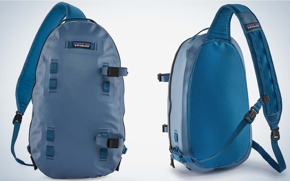 The front and back of a blue fishing sling pack