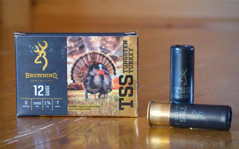 Two black shot shells next to a black box of the best turkey loads
