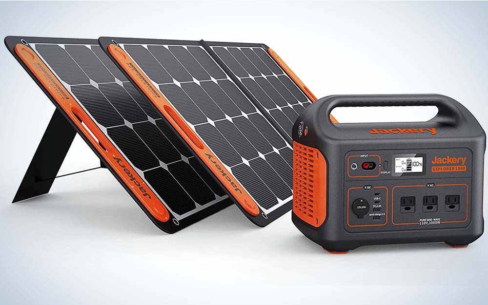 Black and orange solar panels and a generator