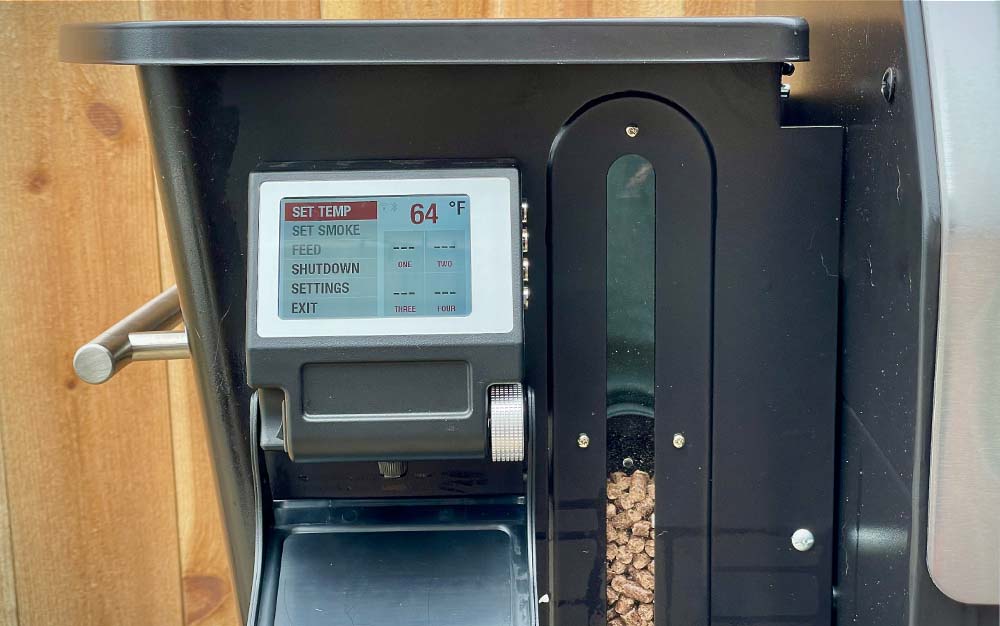 A screen on the side of a best pellet smoker that controls temperature
