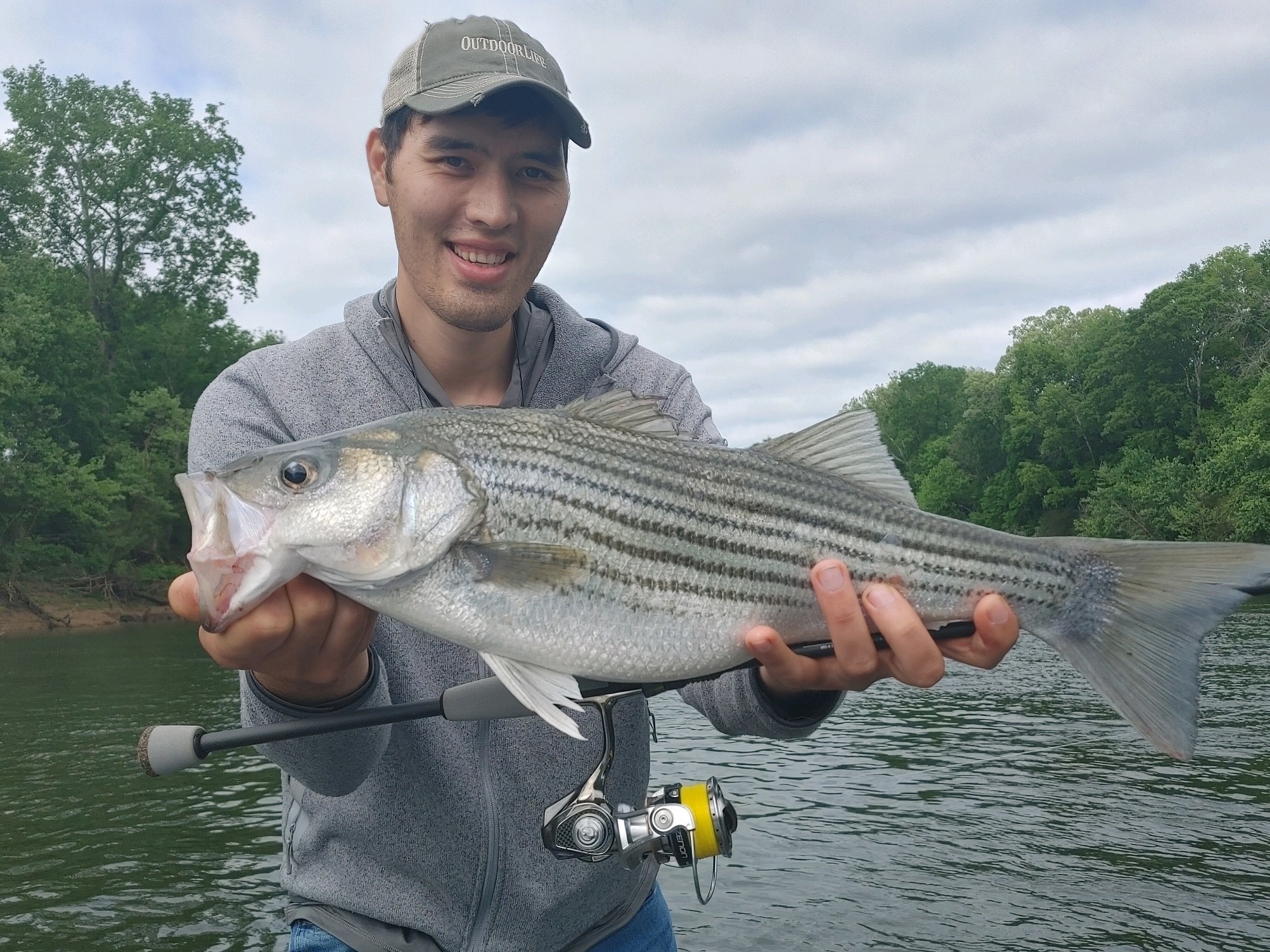 Angler with striped bass