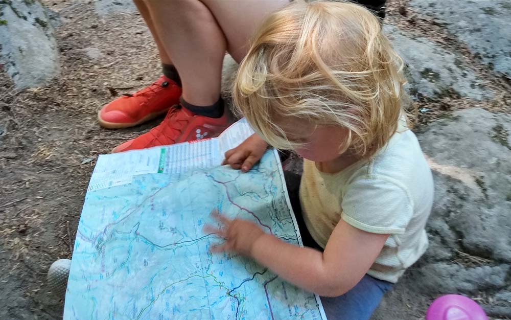 A child reading a map