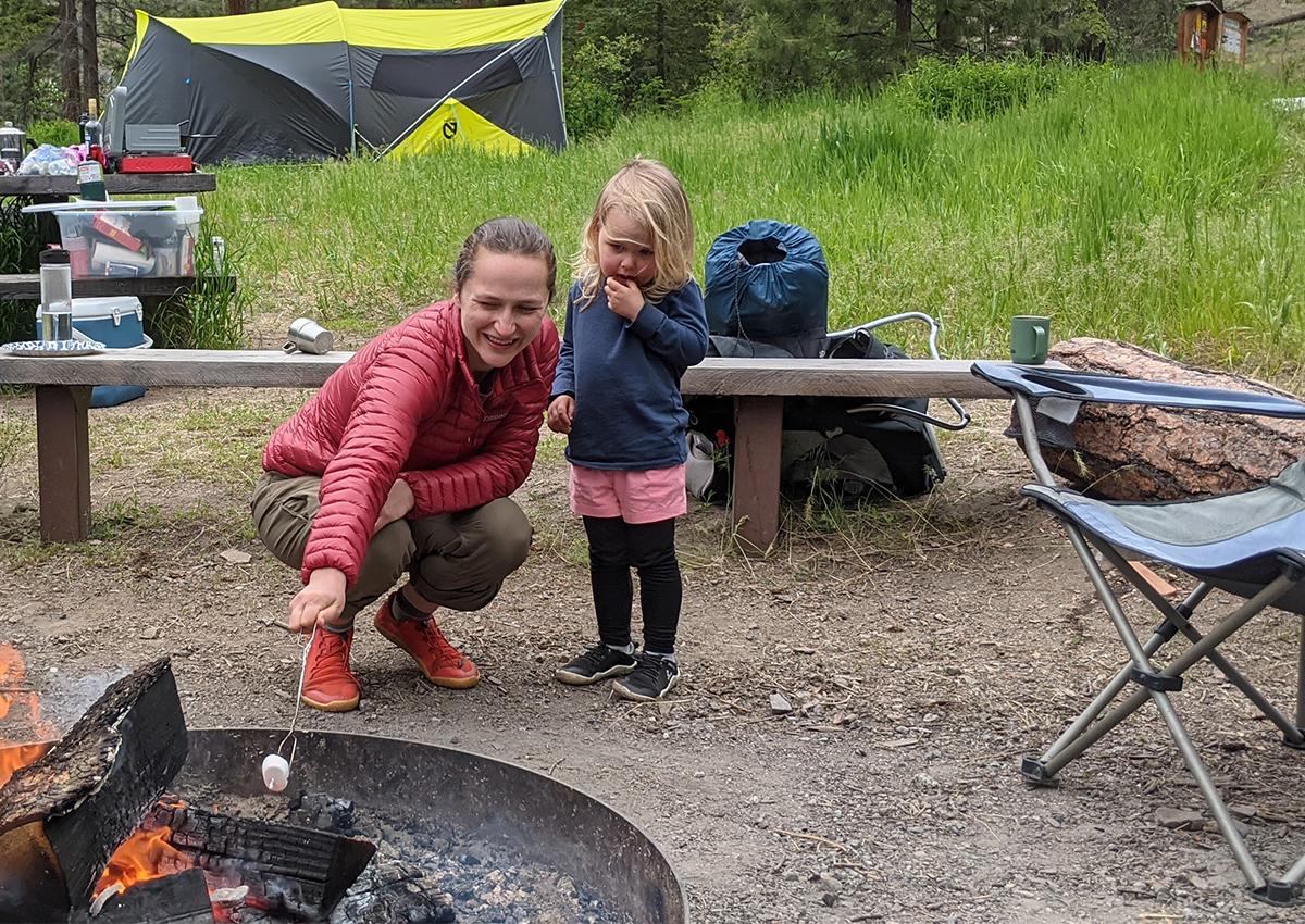 Author is roasting a marshmallow with her daughter.