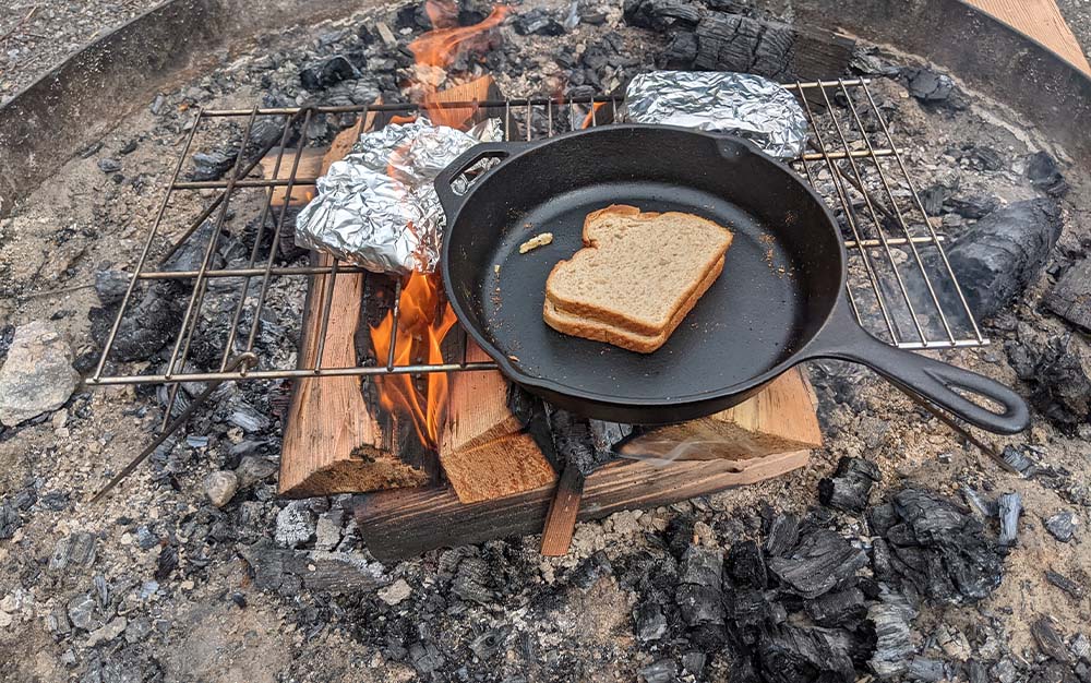 Cooking with the best camping cookware for an open fire
