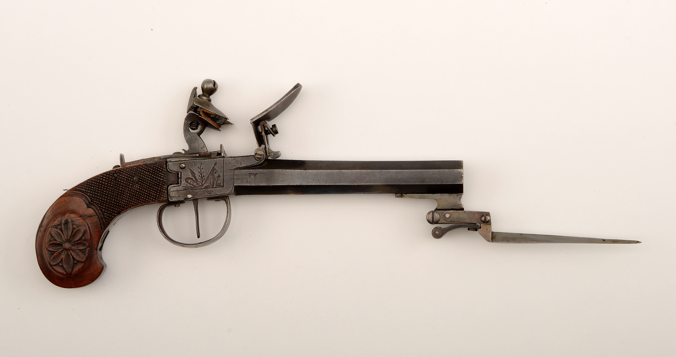 This English dagger flintlock would be tough to carry in the front pocket of your bluejeans.