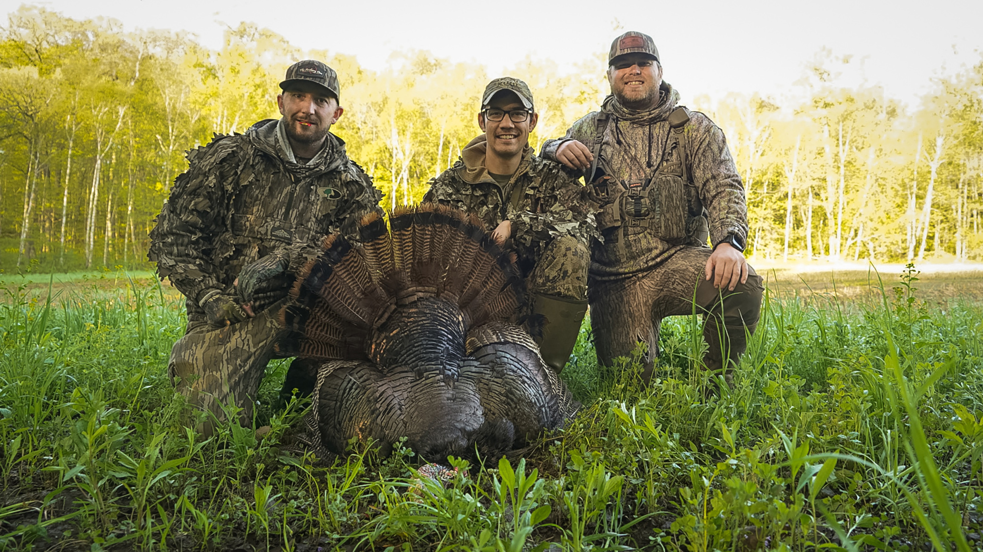 Three turkey hunters in camo