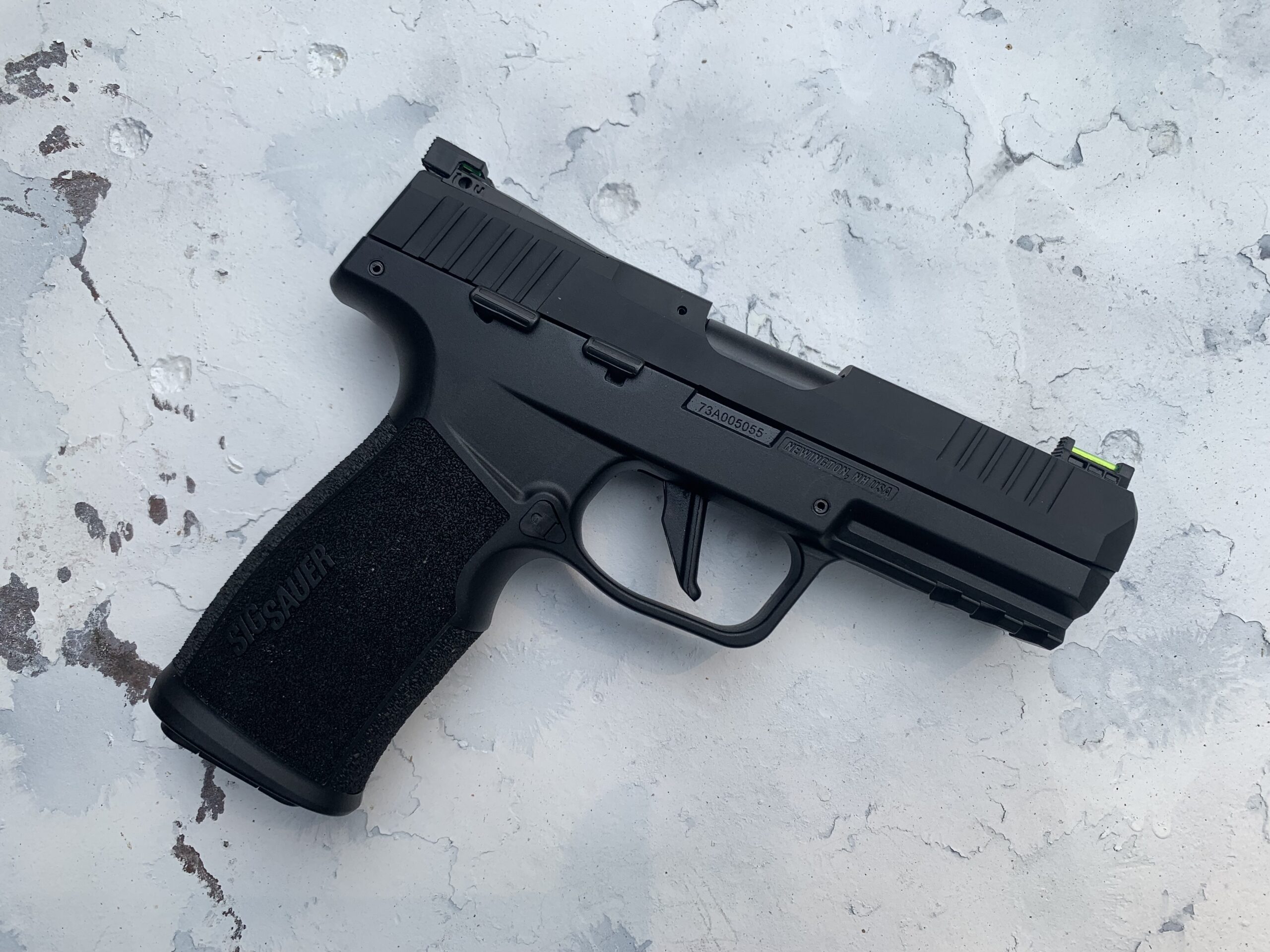 The Sig P322 has a full 3-slot rail and tactile cocking serrations