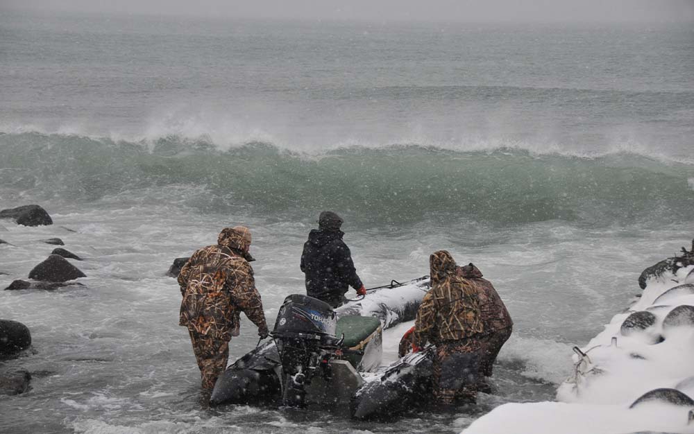 Hunters launch for an icy hunt for King Eiders in the Bering Sea.