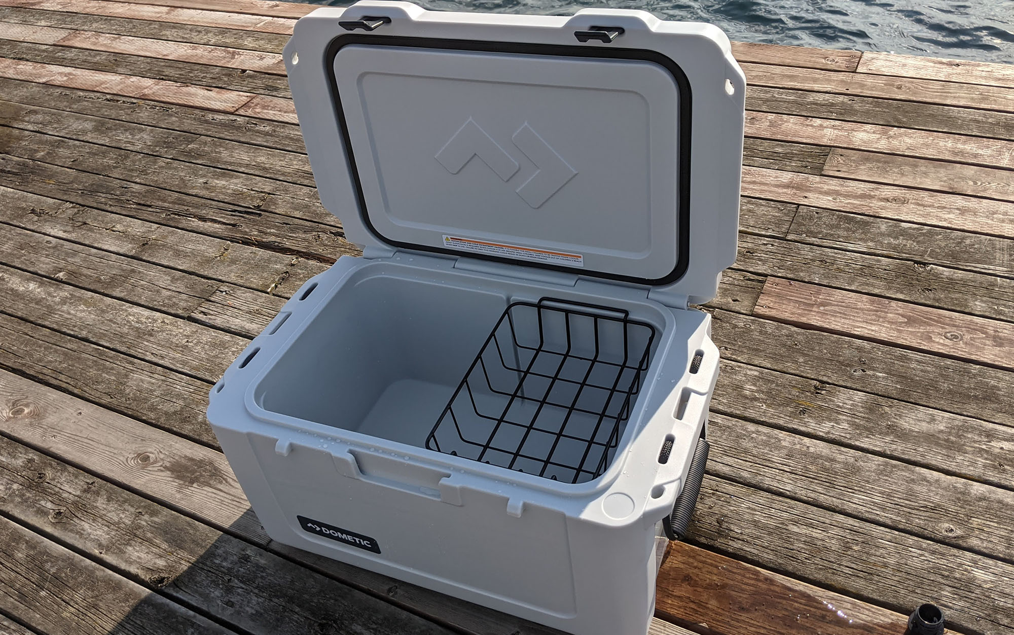 Dometic Patrol cooler sits open on dock.