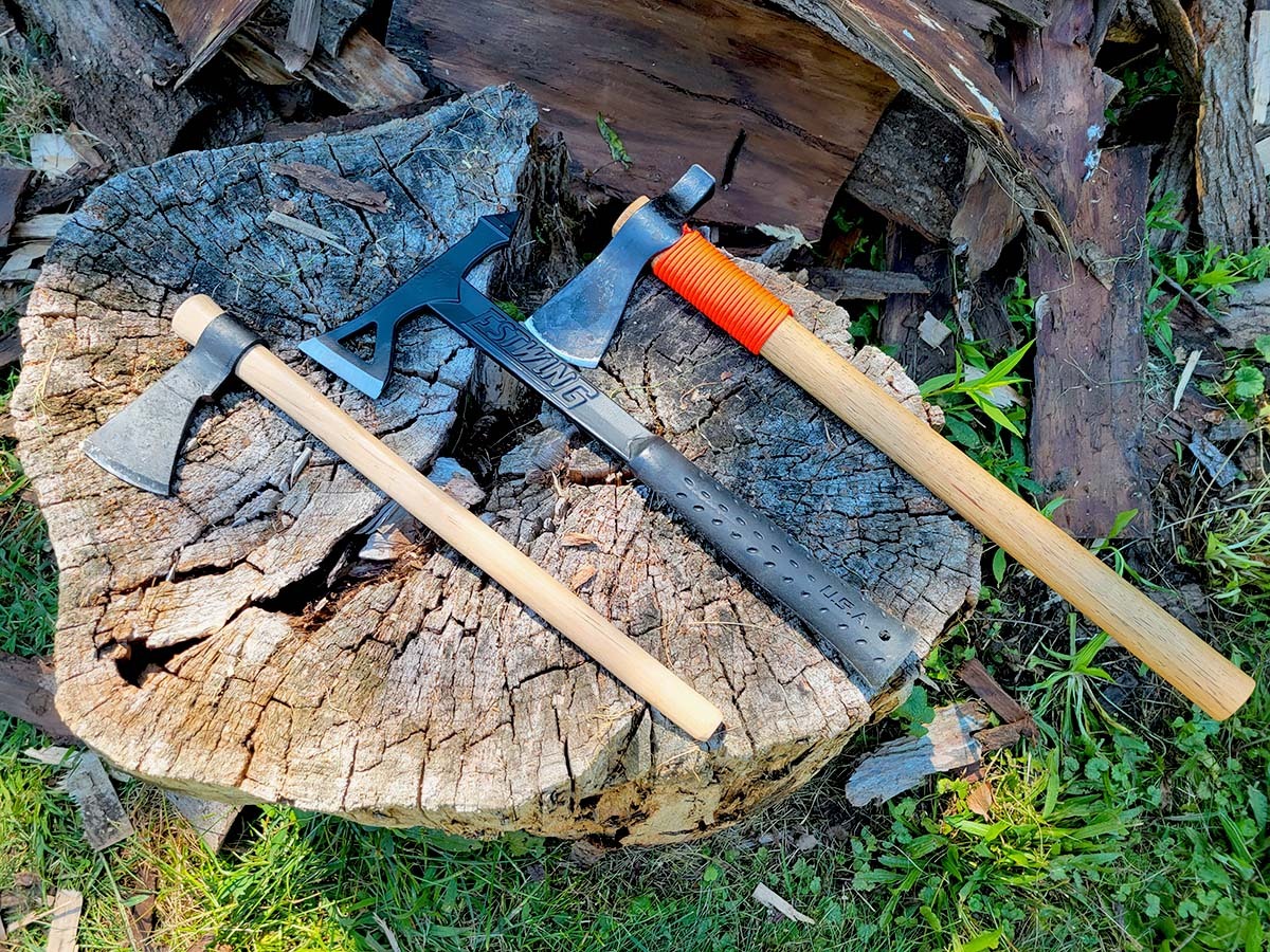 The best tomahawks laying on a stump.