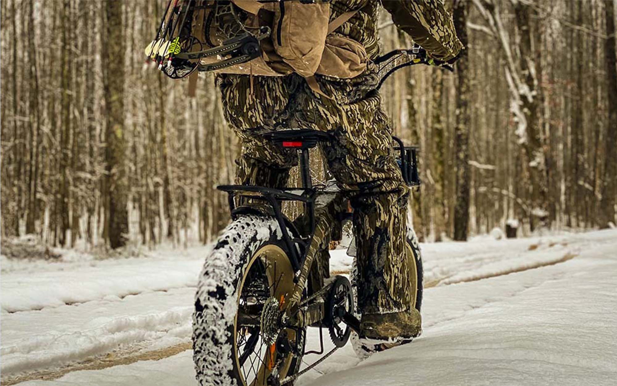 Hunter rides an ebike through the snow.
