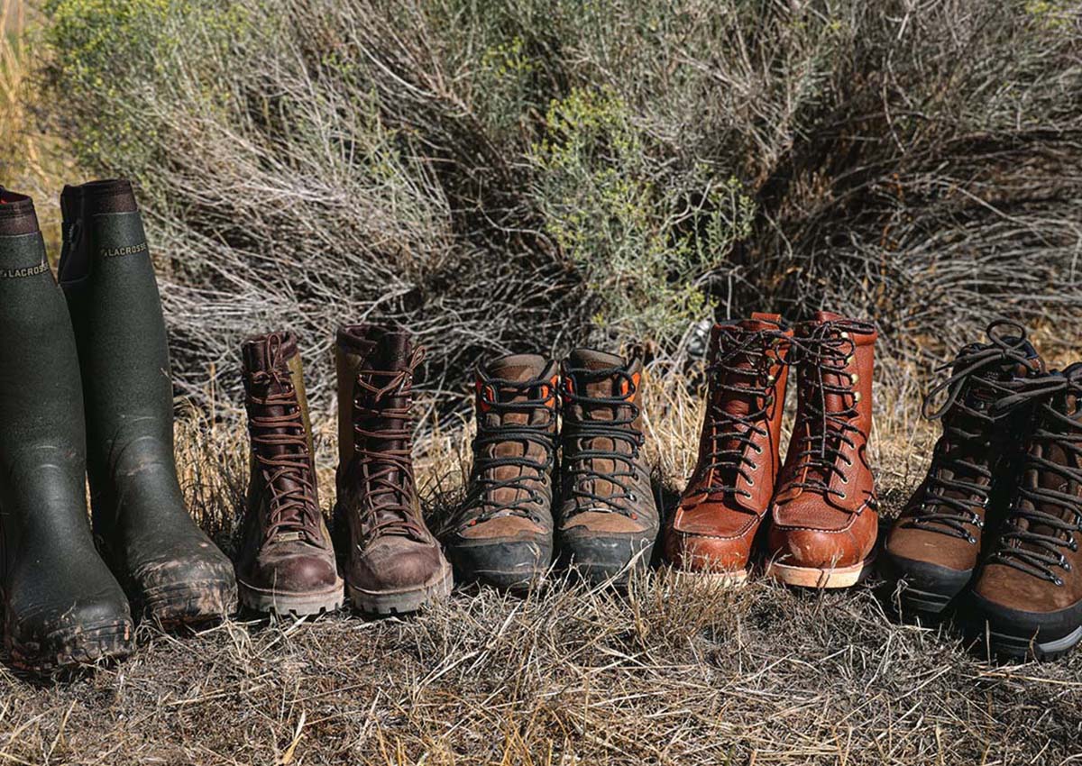 The best upland hunting boots are sitting in a row on the trail.