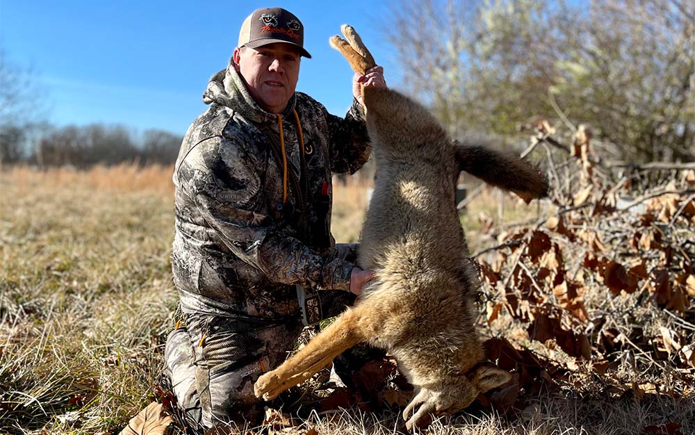 Hunter with a coyote