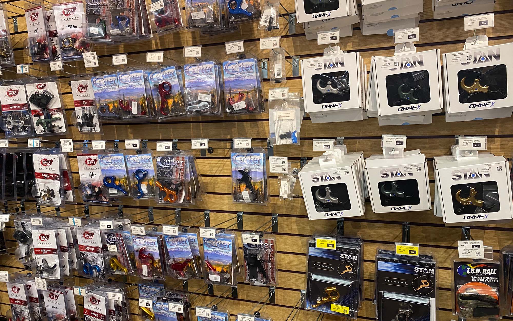 A retail store's stocked wall of bow releases.