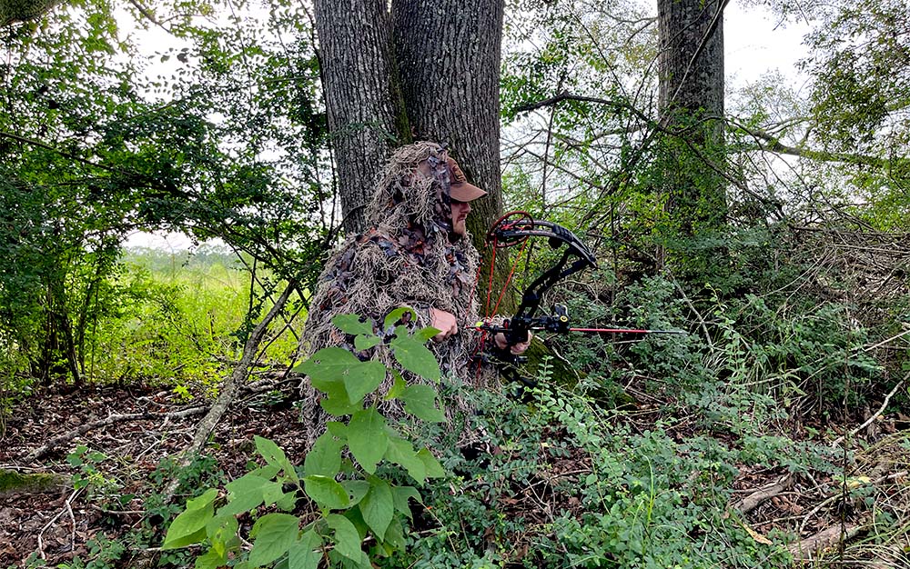 The North Mountain Gear Hybrid Ghillie in the timber.