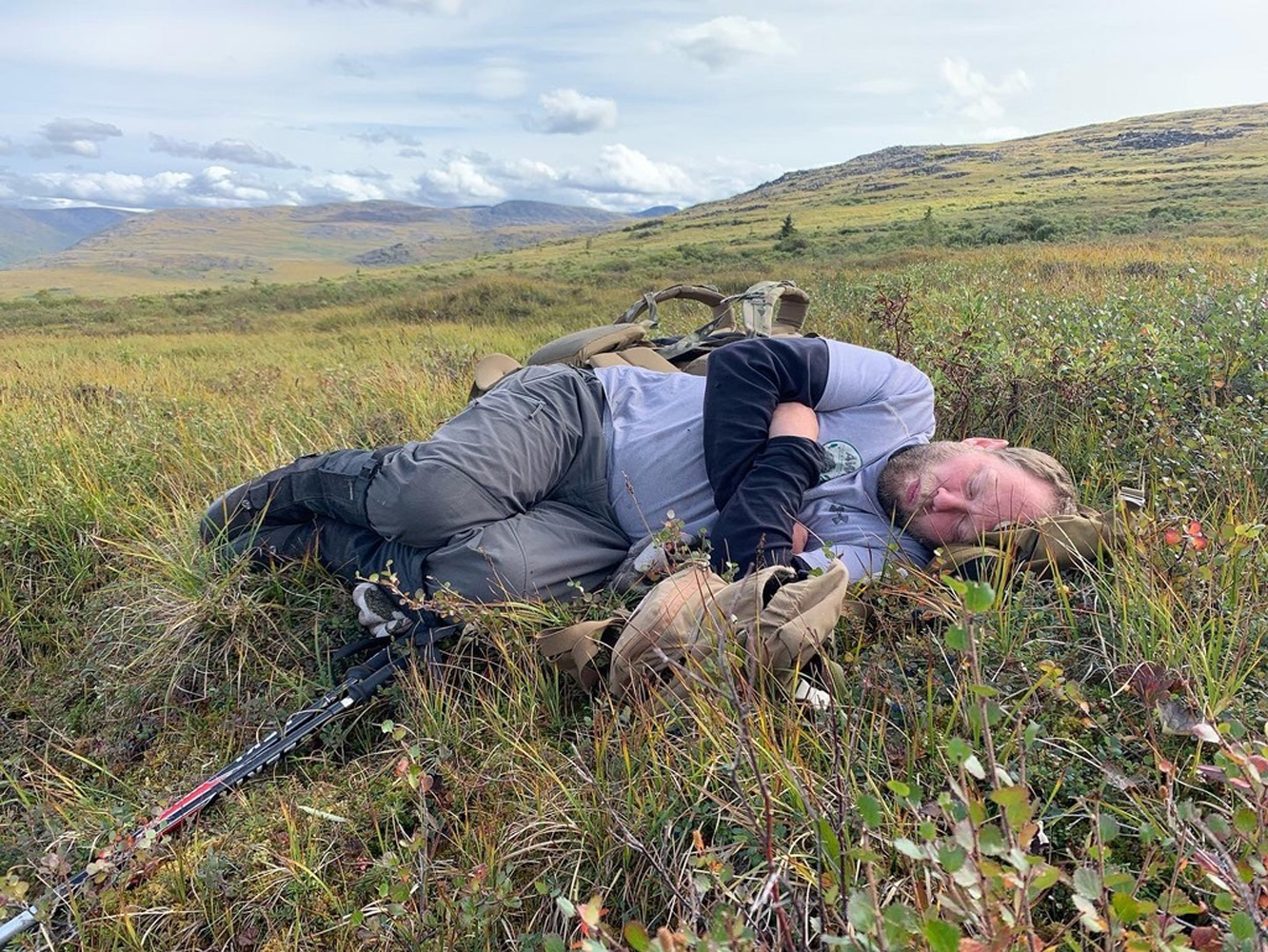 hunter naps in grass