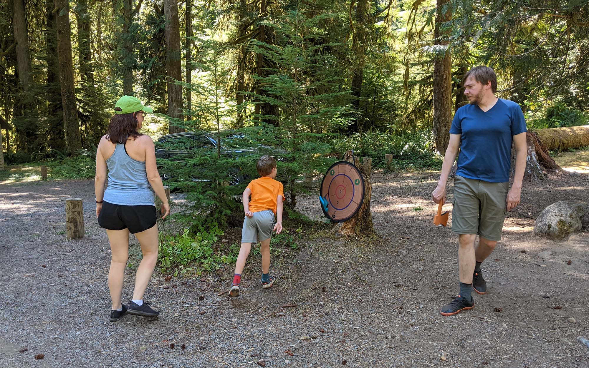 Testers playing with the Outside Inside Travel Axe Throwing camping game.