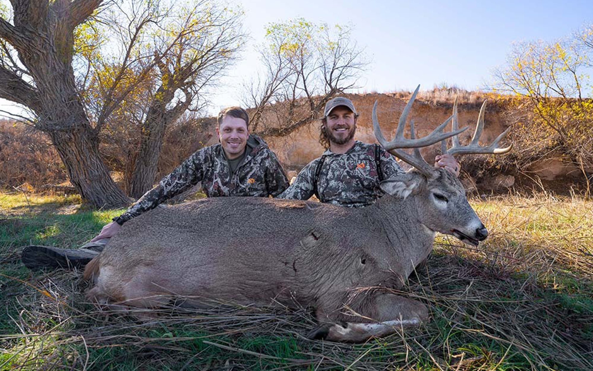 Tyler Jones (left) and K.C. Smith (right) with a buck taken behind a decoy. 