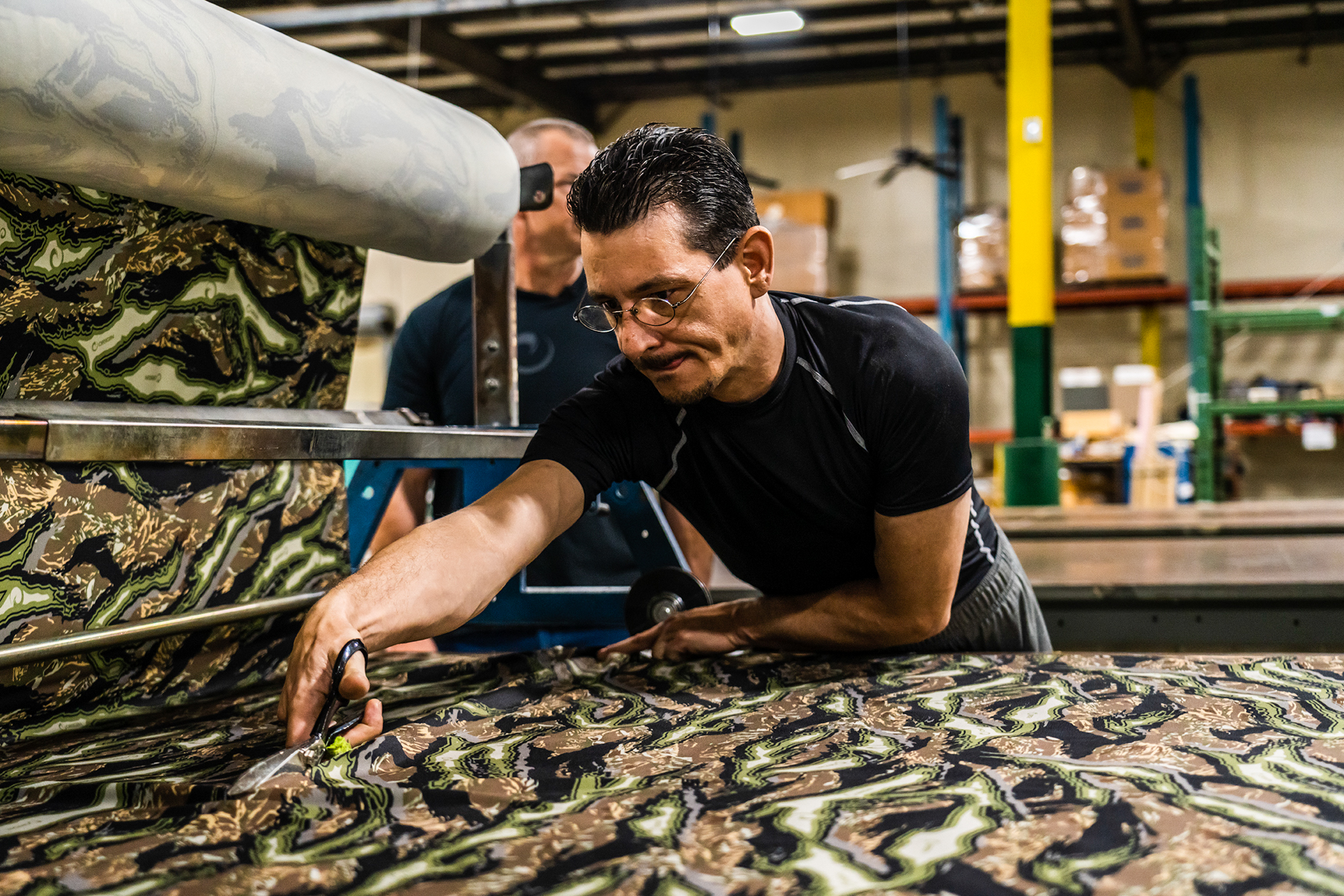 Cutting raptor camo pattern at Origin factory.