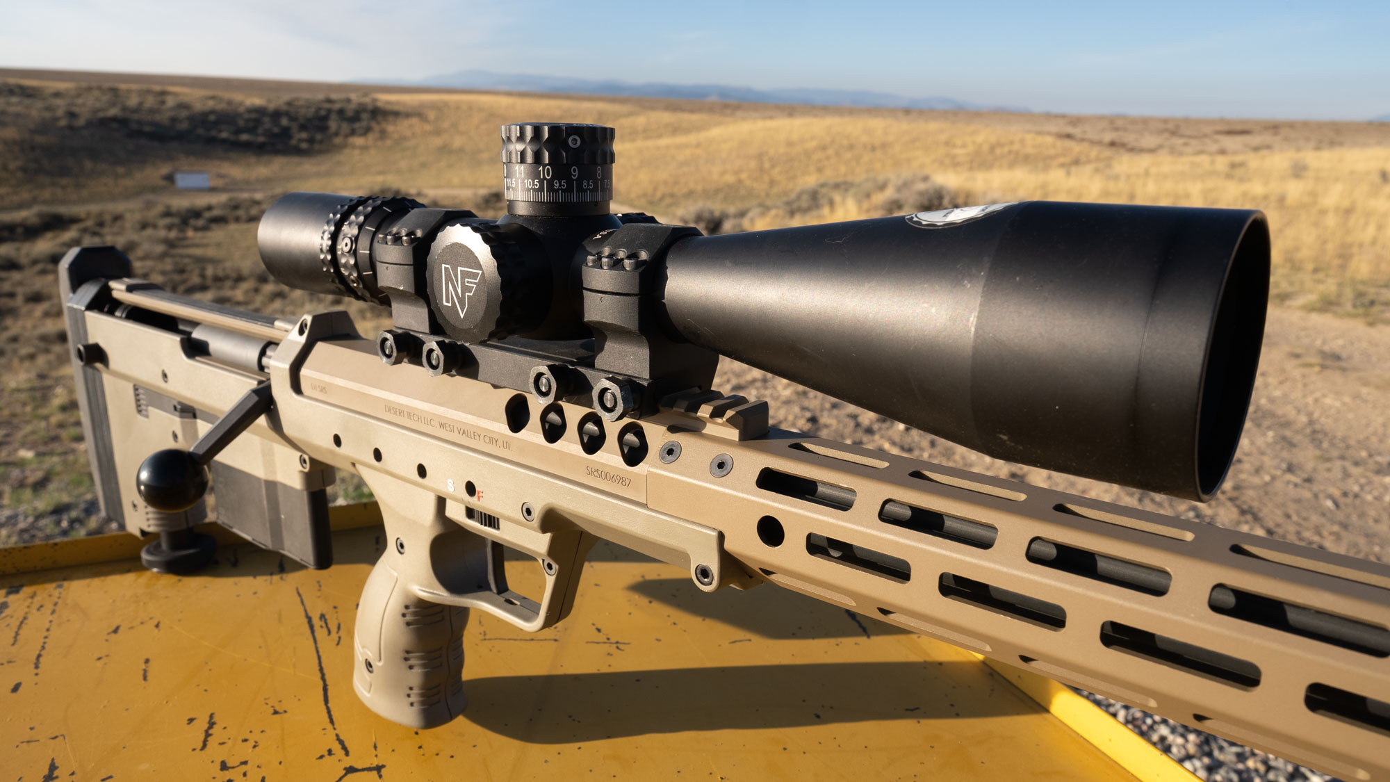 Nightforce scope mounted on a desert tech srs a2 rifle at the shooting range