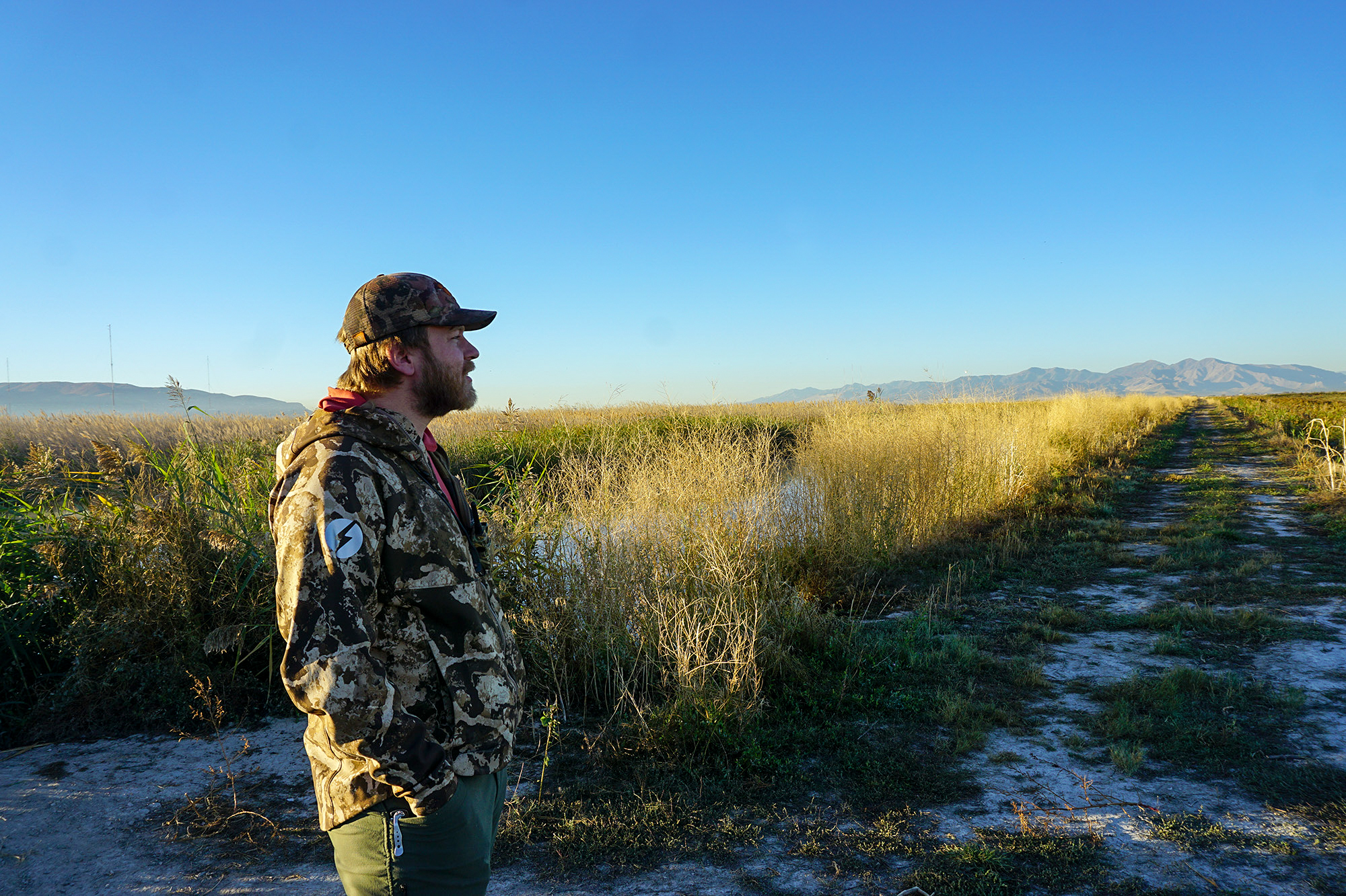 A Utah duck hunter watches the sky above the GReat Salt Lake.