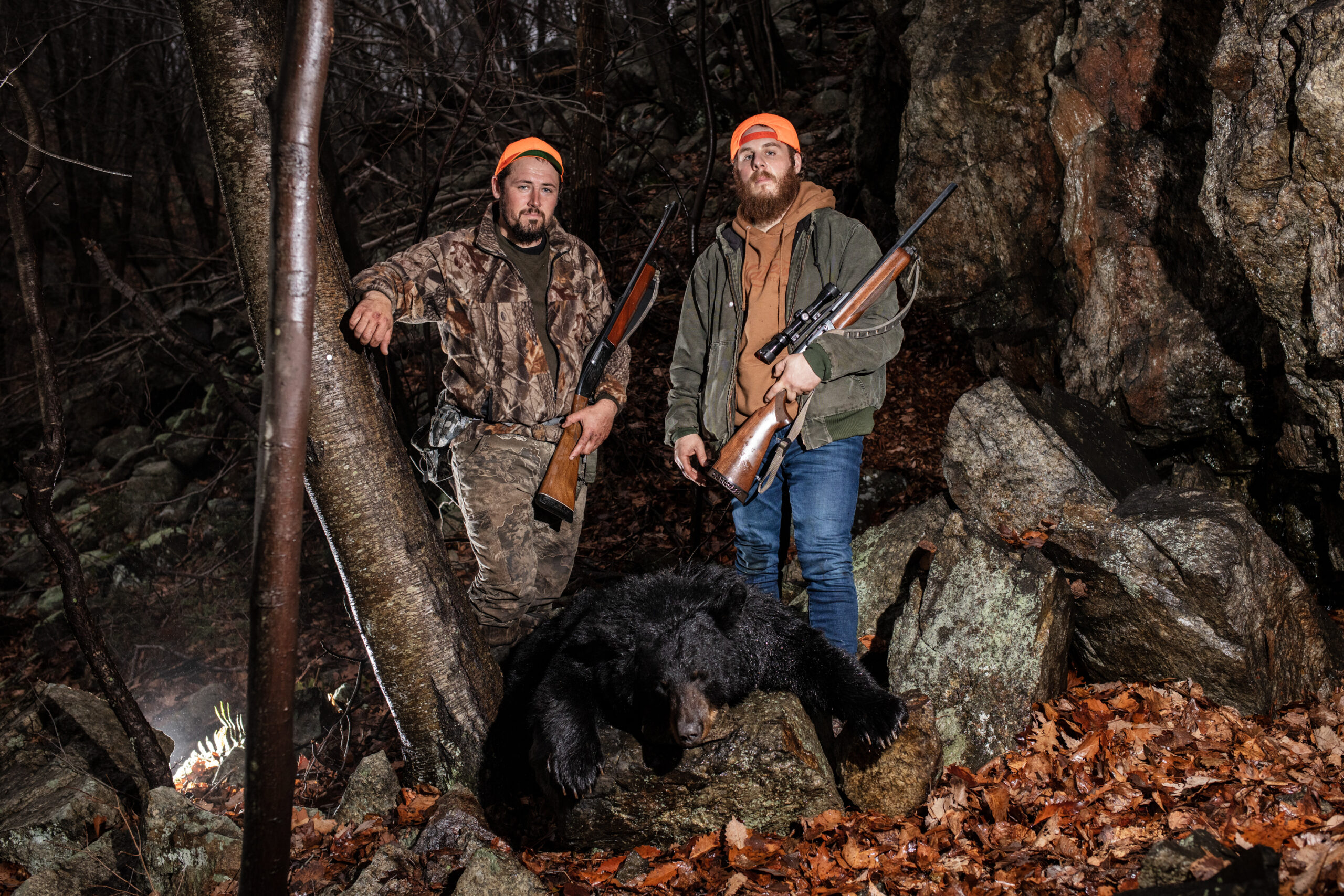 Two New Jersey black bear hunters stand with a mature sow in Jefferson Township.